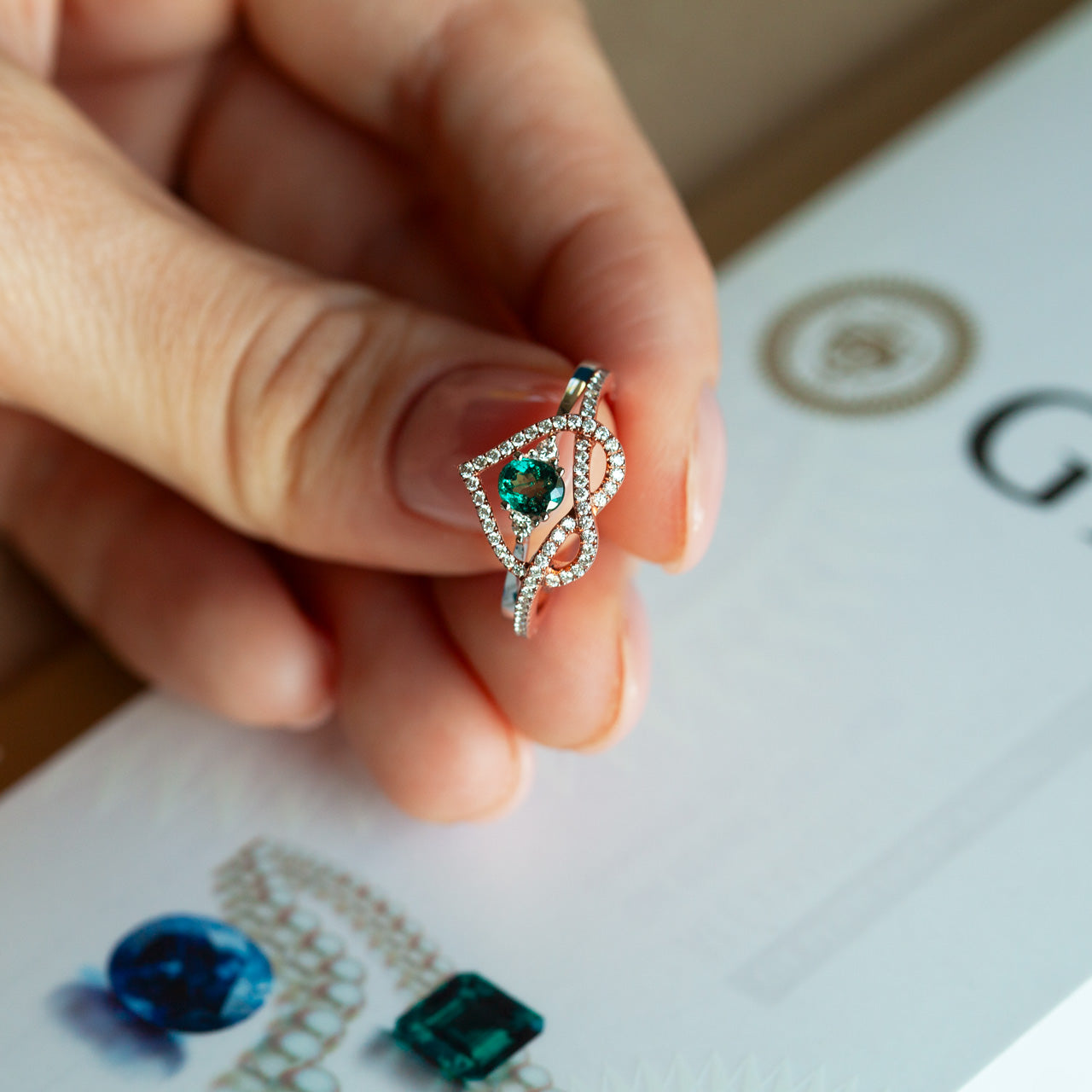 0.50ct natural alexandrite 18k white and rose gold double ring set with diamond accents held between fingers