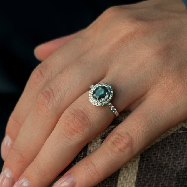 A woman's hand displaying a 1.17ct natural alexandrite ring set in 18k white gold