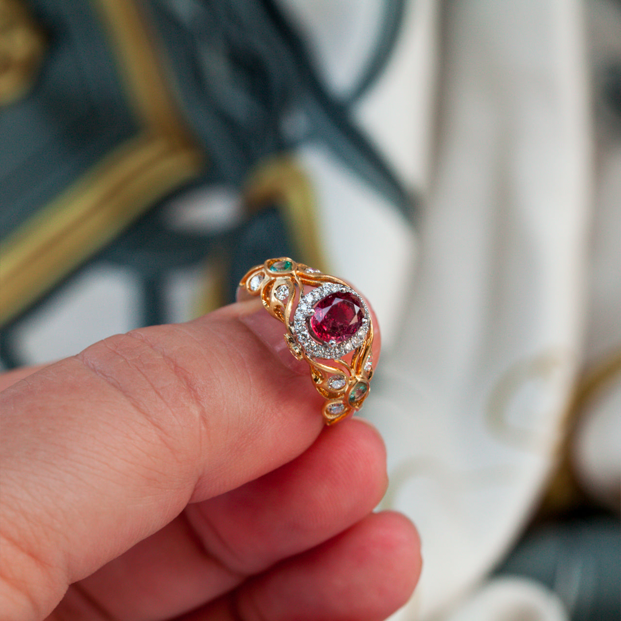 Ruby 18k two tone gold ring with natural untreated ruby center, diamond halo, and alexandrite accents in vintage filigree design