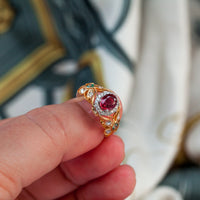 Thumbnail for Ruby 18k two tone gold ring with natural untreated ruby center, diamond halo, and alexandrite accents in vintage filigree design