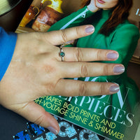 Thumbnail for 0.63ct natural alexandrite platinum ring with triple-claw setting and baguette diamonds shown on hand