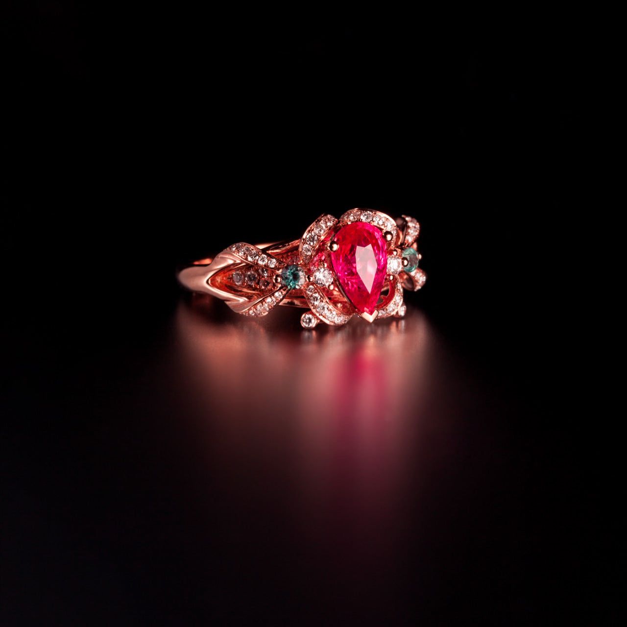 18k rose gold ring with 1.37ctw natural pear-shaped ruby, alexandrite accents, and diamonds