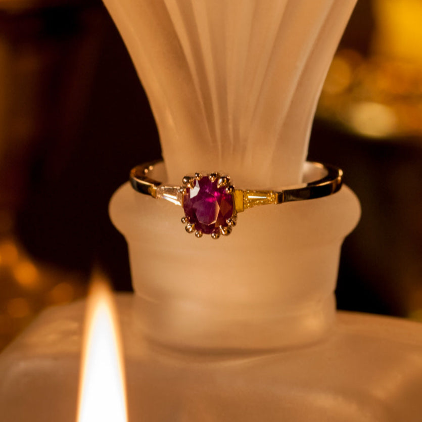 0.63ct natural alexandrite platinum ring with oval color-changing center stone and baguette-cut diamond accents