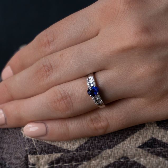 Close-up of a 0.93ct natural blue sapphire ring on a woman's finger