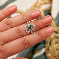 Thumbnail for Natural Alexandrite 18k white gold ring with oval green to reddish-purple color-changing gemstone and diamond accents on hand