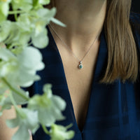 Thumbnail for Natural Alexandrite pendant in 18k white gold with diamond halo on a woman's neck