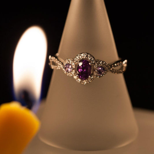 18k white gold ring featuring a 0.42ct natural alexandrite on a display stand