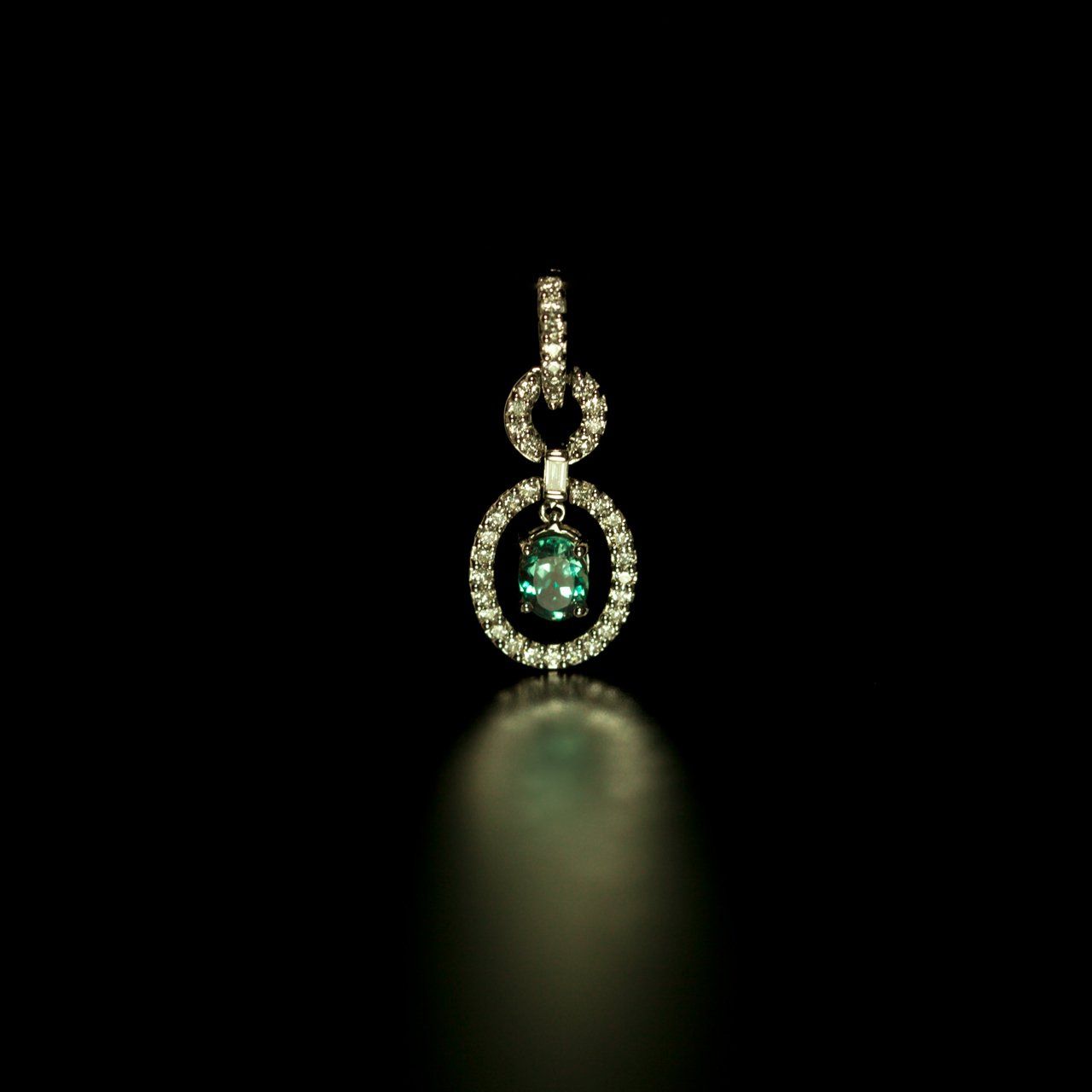 0.39ct alexandrite set in an 18k white gold pendant, illuminated to show gemstone clarity