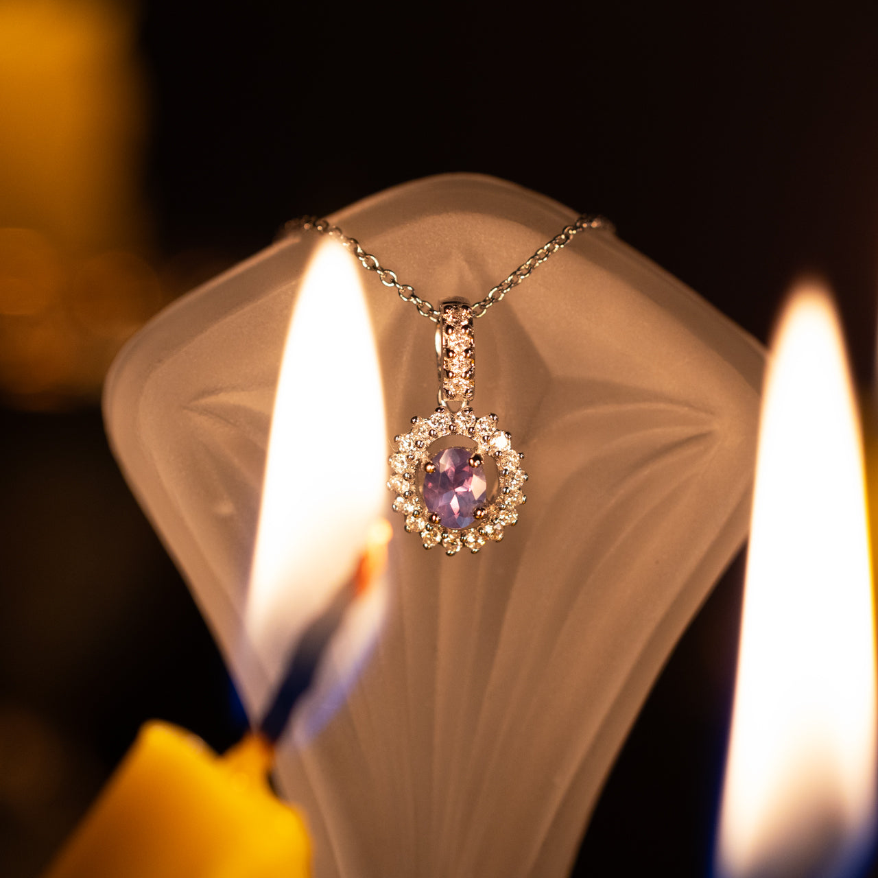 Natural alexandrite and diamond halo pendant in 18k white gold with color-changing gemstone