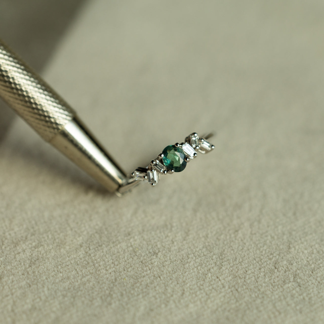 0.25ct natural alexandrite oval cut stackable ring with six baguette diamonds set in 18k white gold