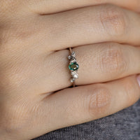 Thumbnail for Close-up of a hand wearing a delicate 0.25ct natural alexandrite and diamond 18k white gold stackable ring