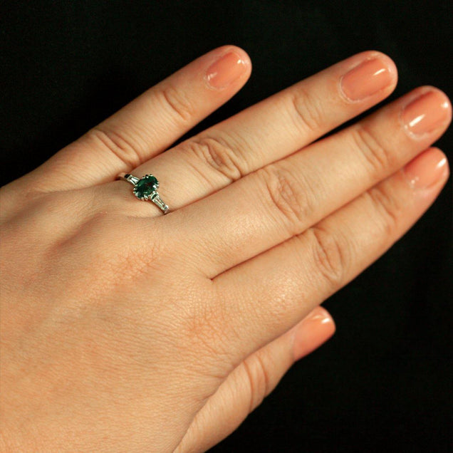 Woman's hand showcasing a platinum ring with a 1.23ct natural alexandrite