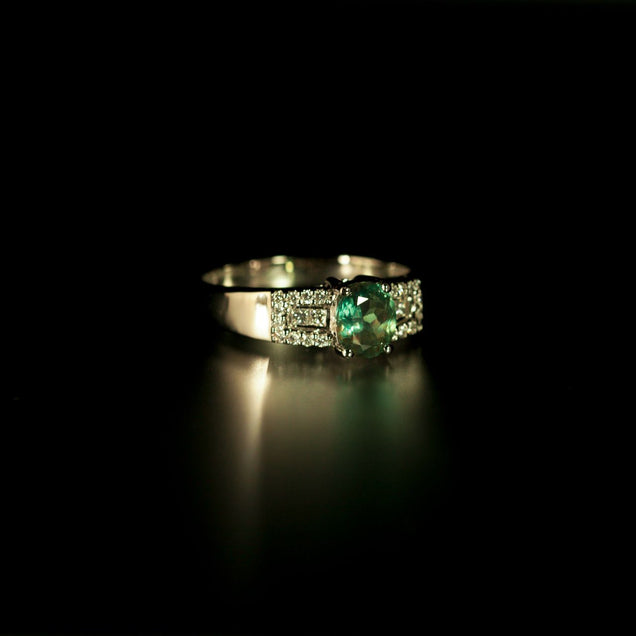 Luxurious white gold ring with a 1.22ct alexandrite exhibiting green hues and diamond accents