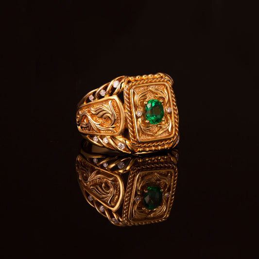 18k yellow gold men's signet ring with a 0.64ct natural emerald on a black backdrop