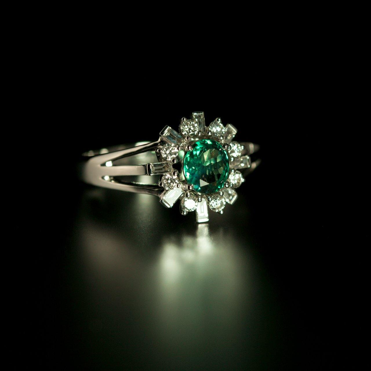 Elegant 0.78ct alexandrite ring set in platinum with a halo of sparkling diamonds