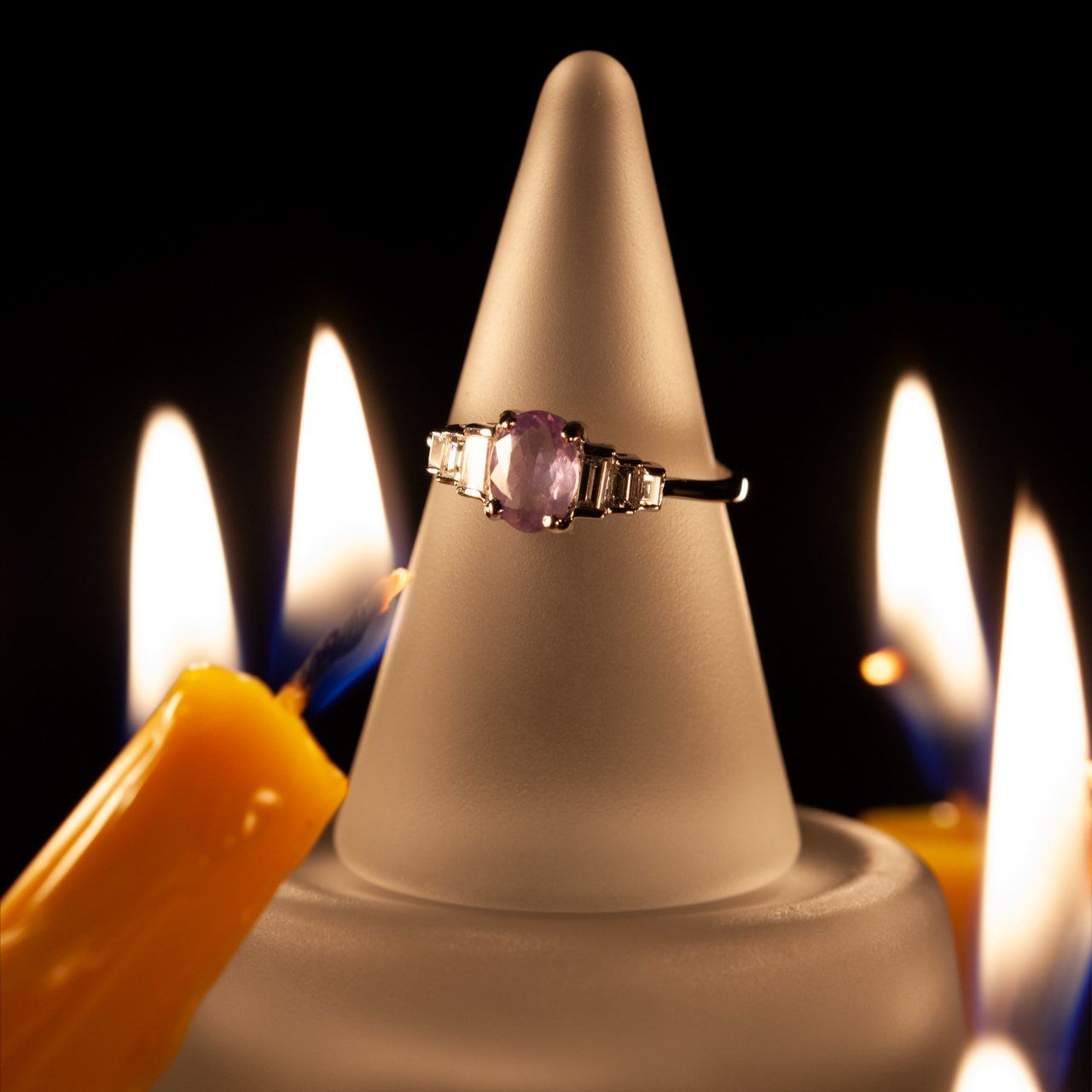 Elegant 0.71ct alexandrite ring with diamond halo on a candle base