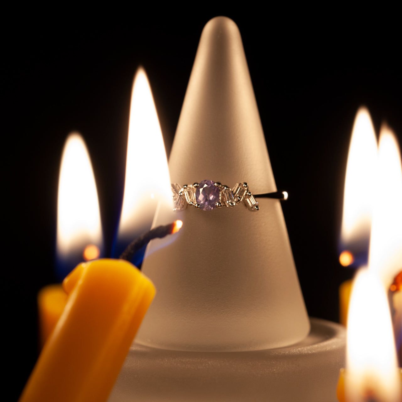 0.35ct alexandrite ring on a candle for a romantic display setting