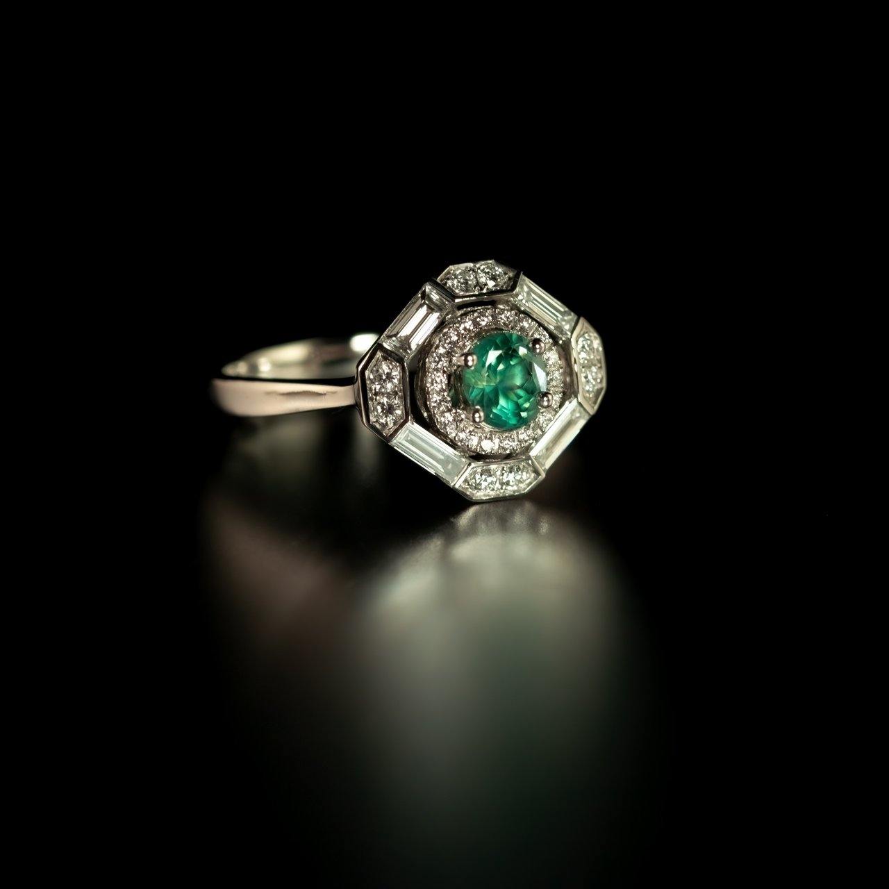 A platinum ring featuring a 0.60ct alexandrite stone, styled in an art deco design
