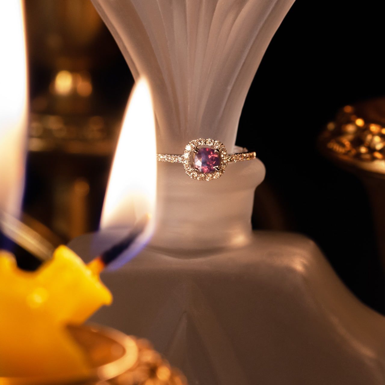 0.45ct natural alexandrite 18k white gold ring displayed on a candle for ambiance