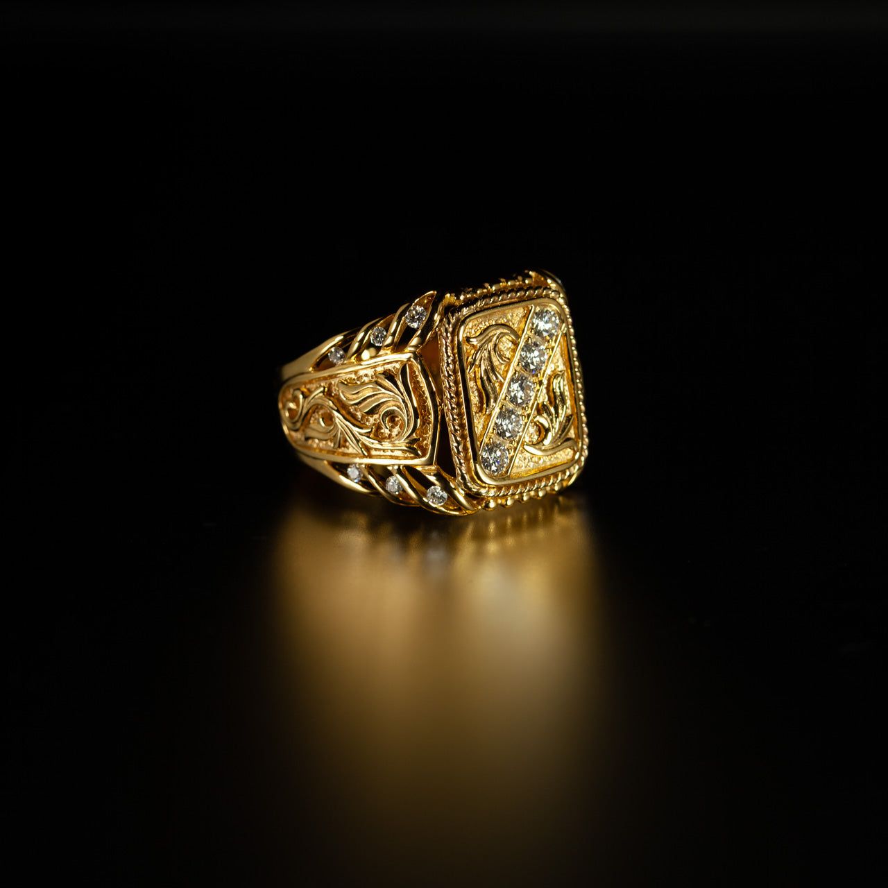 Angled view of the 18k yellow gold signet ring with diamond accents