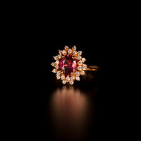 Thumbnail for A detailed view of a 1.28ct pink sapphire and diamond ring in an 18k yellow gold setting