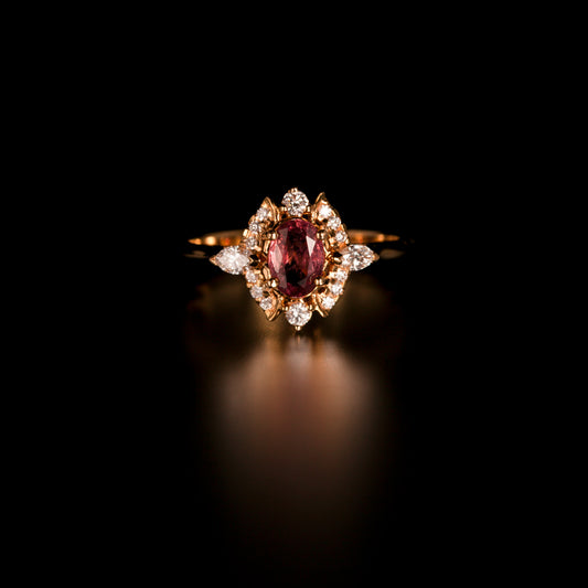 Elegant 0.76ct pink sapphire ring with gold band on display