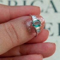 Thumbnail for Detailed view of a hand holding a 0.71ct natural alexandrite ring in an 18k white gold band